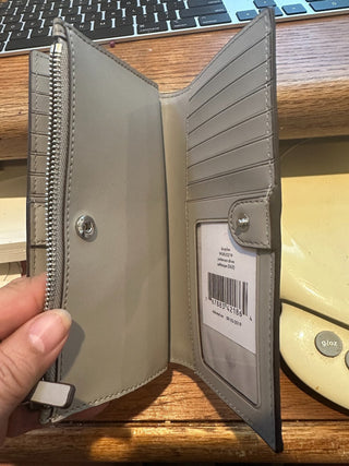 Kate Spade NY Gray Folding wallet, new w/tags 4"x6" RCD