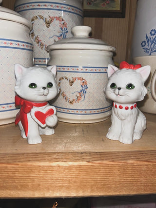Pair of ceramic cats with bows. Lacy’s Attic|146164
