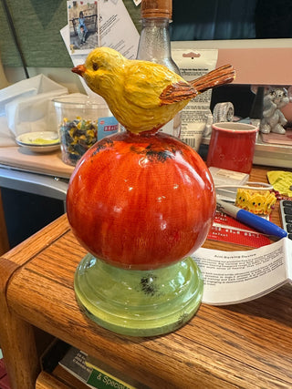 Baby Bird on Orange Orb, atop green circular stand, 6.5" RCD|92944