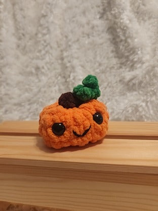 Medium Happy Pumpkin: Crocheted. Orange, brown, green, black