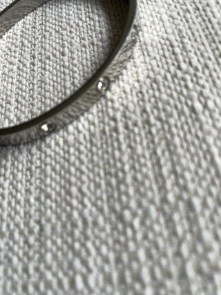 Silvertone bangle bracelet with clear crystals