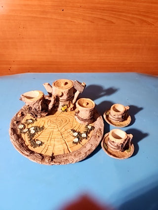 Miniature t set designed to look like tree stumps and wood great for collectible or fairy gardens