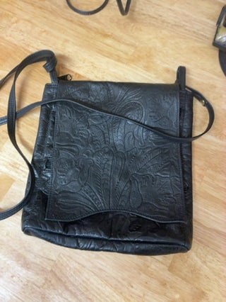 "Michelle Barclay Boutique Designer Crossbody Bag. Genuine thick tooled black leather with signature purple suede interior lining. Excellent condition!"