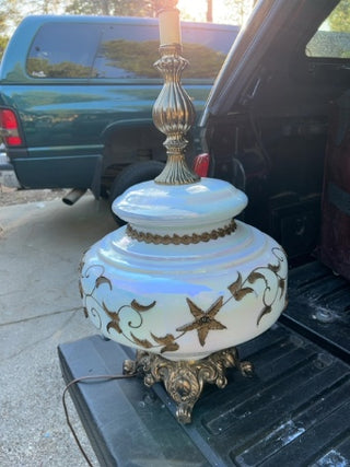 vintage table lamp features a white opalescent milk glass with gold floral designs