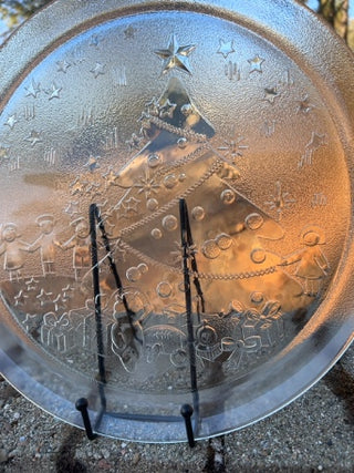 vintage 13-inch clear tempered glass Christmas serving platter featuring an embossed holiday scene