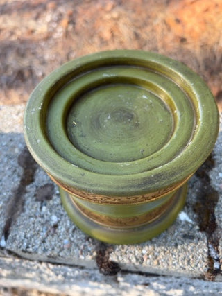 JP Pier One decorative botanical pillar candle featuring embedded olive-green pedestal holder