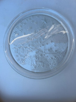 vintage 13-inch clear tempered glass Christmas serving platter featuring an embossed holiday scene