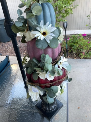 Three tiered pumpkin floral statue arrangement