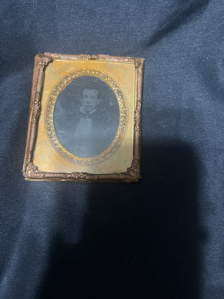 gilded gold frame with picture of a man rsv