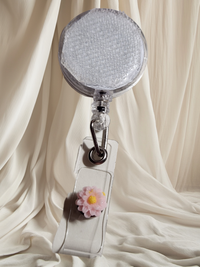 Belt Clip Interchangeable Badge Reel with Retractable Reel. Badge Button: Pink Flower. Our Interchangeable Badge Reels are made to be used with our Interchangeable Badge Reel Charms.|63703