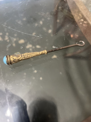 Gold and teal shoe tool rsv