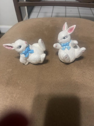 RSV. White ceramic bunnies, blue bow