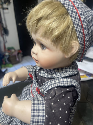 porcelain baby doll in overalls rsv