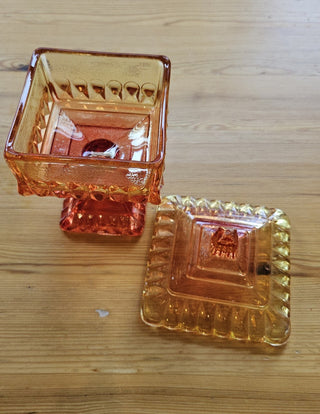 Vintage Jeannette Amberina glass "Wedding" candy dish Square-shaped candy dish with a matching lid and a pedestal base. RSV|106958
