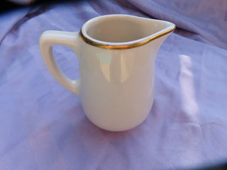 Creamer with gold rim Made in USA  MTS