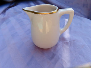 Creamer with gold rim Made in USA  MTS