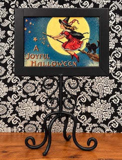 Framed Witch in wrought iron stand