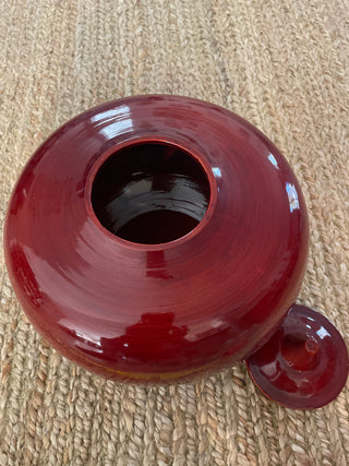 Large red decorative bowl with lid
