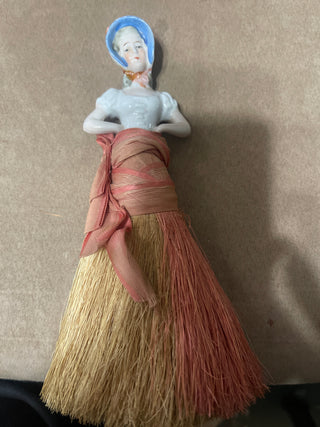 large whisk  broom, woman with blue hat.  Repaired as is.