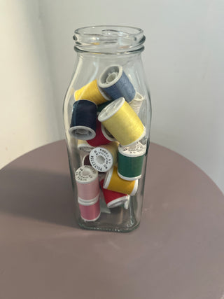 Jar of multi color thread