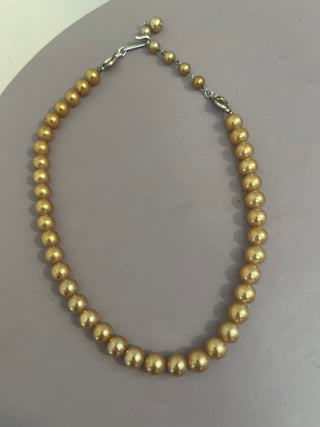 Faux gold tone pearls