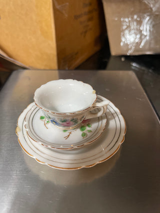 small teacup two plates