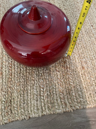 Large red decorative bowl with lid