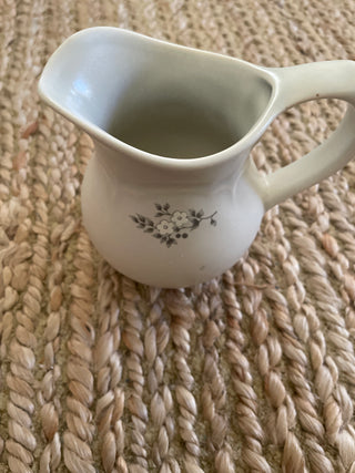 This is a vintage Pfaltzgraff creamer in the "Heirloom" gray floral