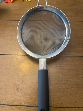 Hand held strainer