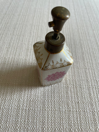 Vintage perfume bottle, pink and gold design