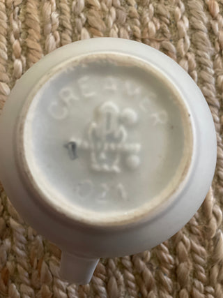 This is a vintage Pfaltzgraff creamer in the "Heirloom" gray floral