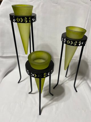 three green votive candle holders