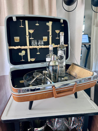 Tan Samsonite suitcase bar